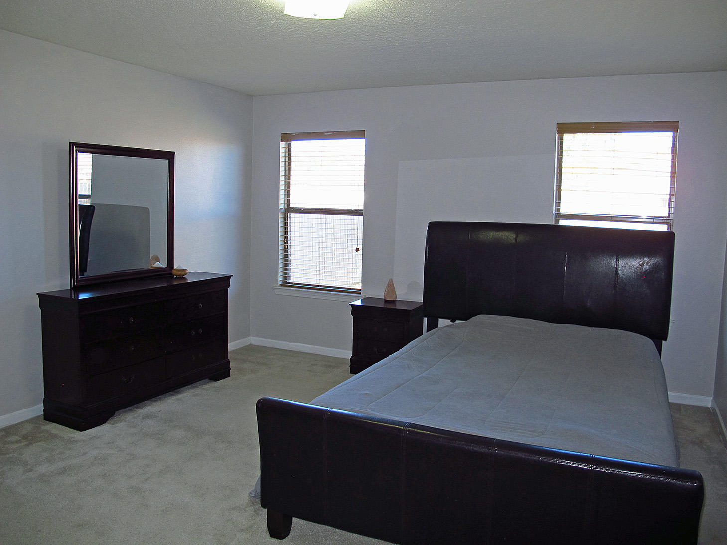 7980 Promise Creek Road Navarre, FL 32566 - Photo 17 of 31 a bedroom with a bed and a window
