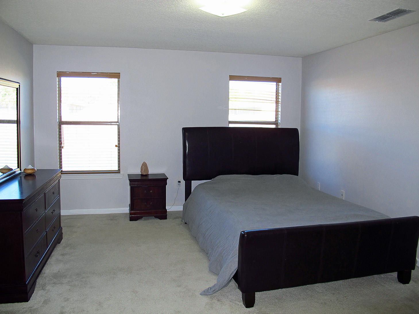 7980 Promise Creek Road Navarre, FL 32566 - Photo 18 of 31 a bedroom with a bed and window