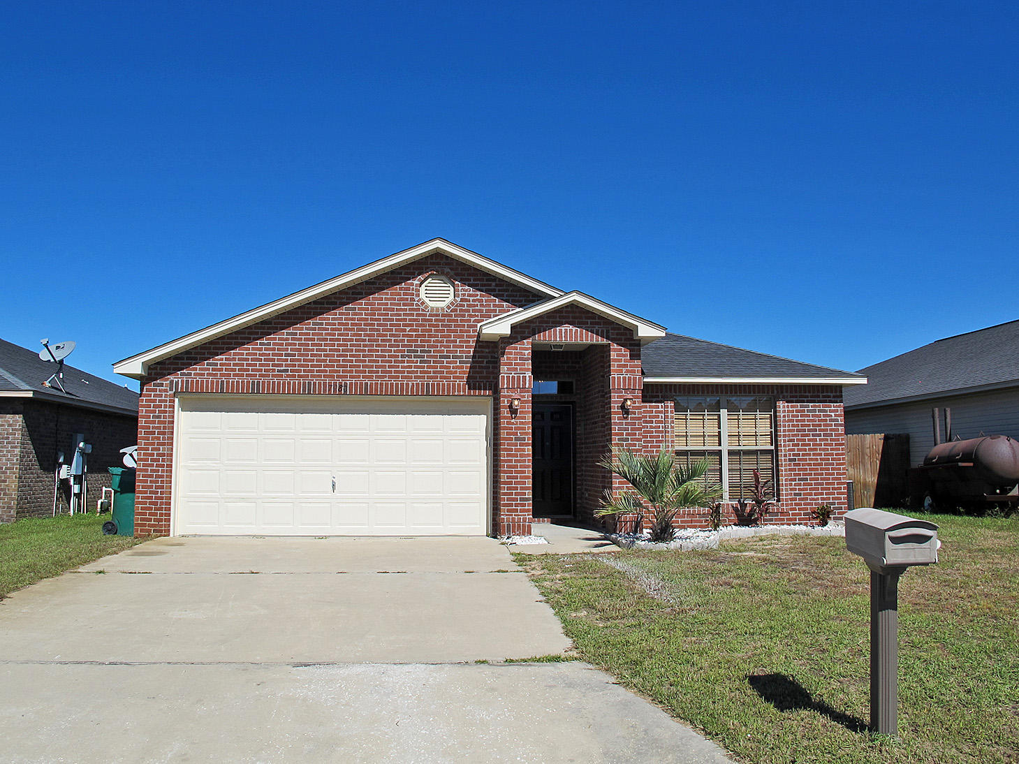 7980 Promise Creek Road Navarre, FL 32566 - Photo 2 of 31 a front view of house with yard