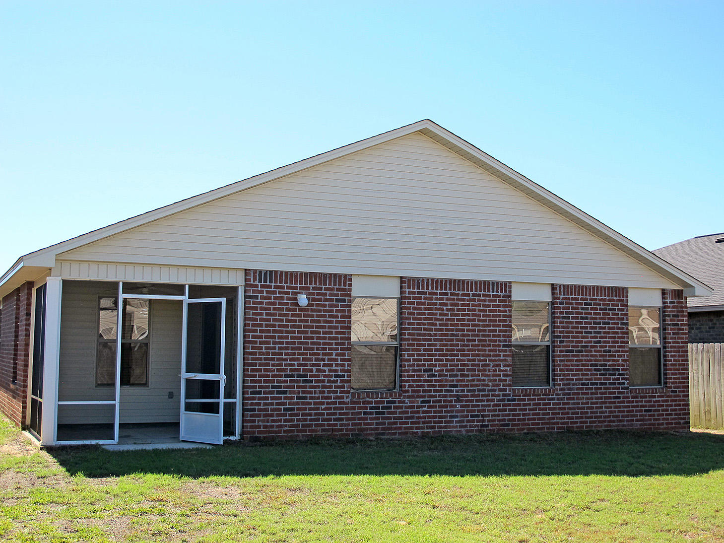 7980 Promise Creek Road Navarre, FL 32566 - Photo 27 of 31 a front view of a house with garage