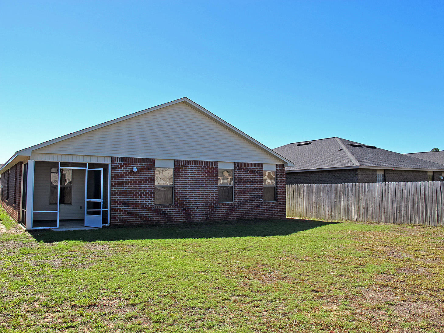 7980 Promise Creek Road Navarre, FL 32566 - Photo 28 of 31 a house with wooden fence