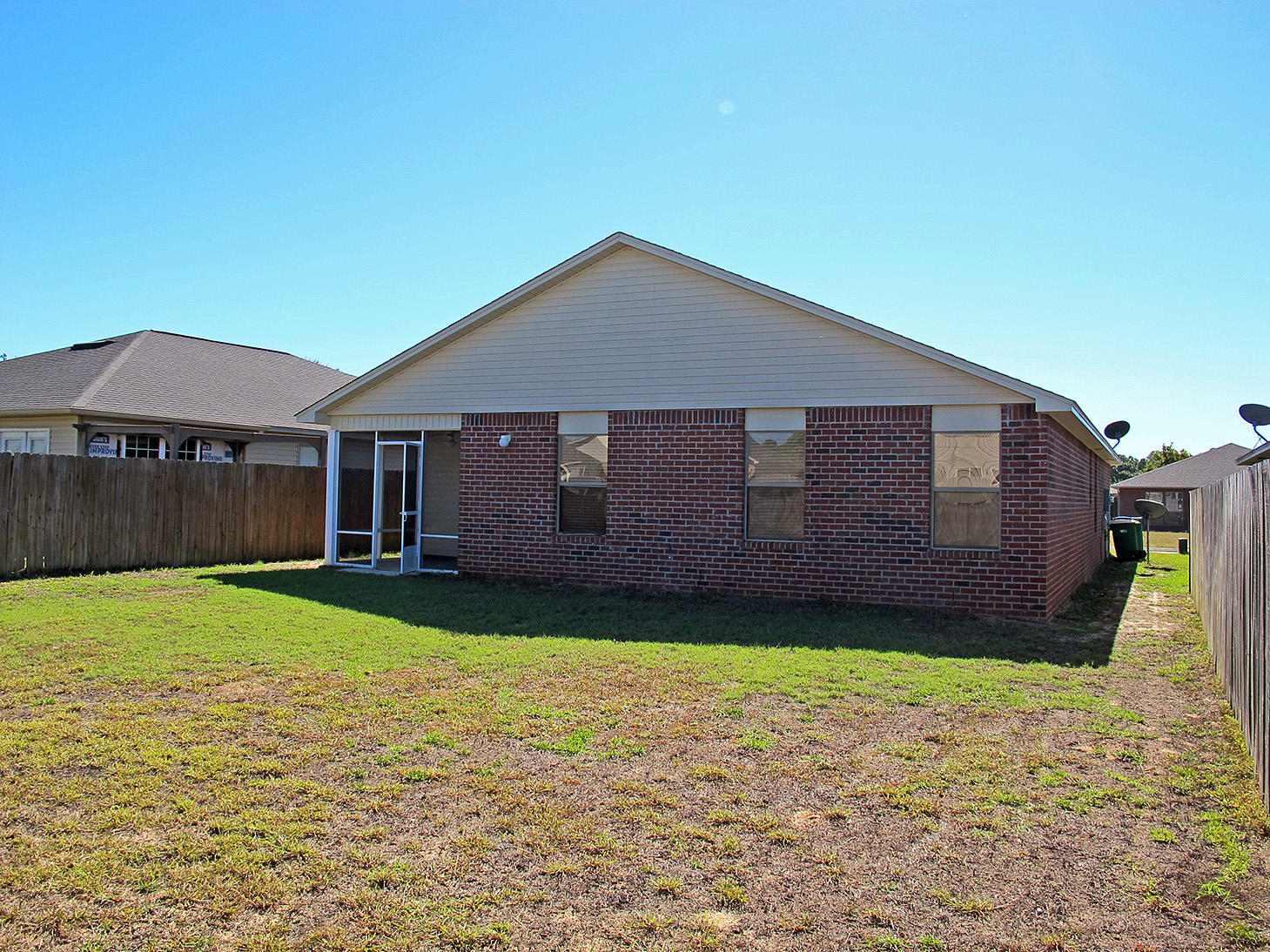 7980 Promise Creek Road Navarre, FL 32566 - Photo 29 of 31 a front view of a house with garden