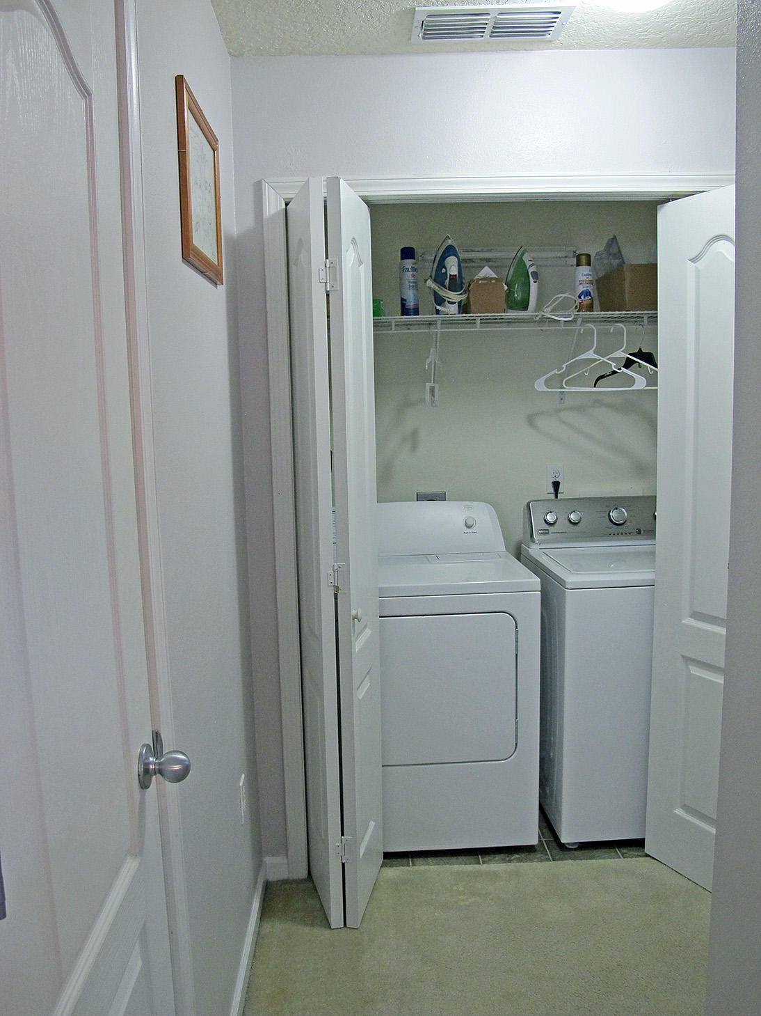 7980 Promise Creek Road Navarre, FL 32566 - Photo 30 of 31 a utility room with dryer and washer