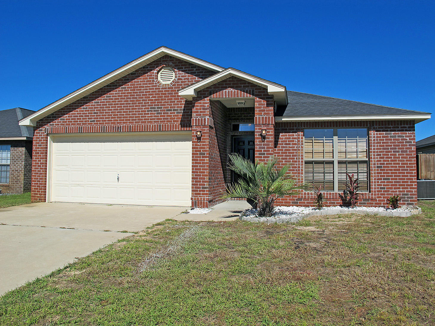 7980 Promise Creek Road Navarre, FL 32566 - Photo 31 of 31 a front view of a house with a yard