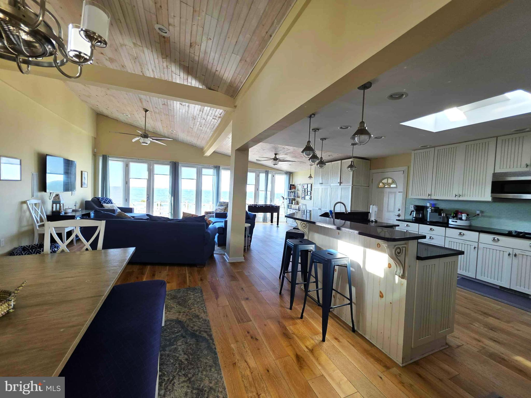 8034 Riverview Road Westover, MD 21871 - Photo 14 of 47 a large kitchen with lots of counter space a sink appliances and a dining table