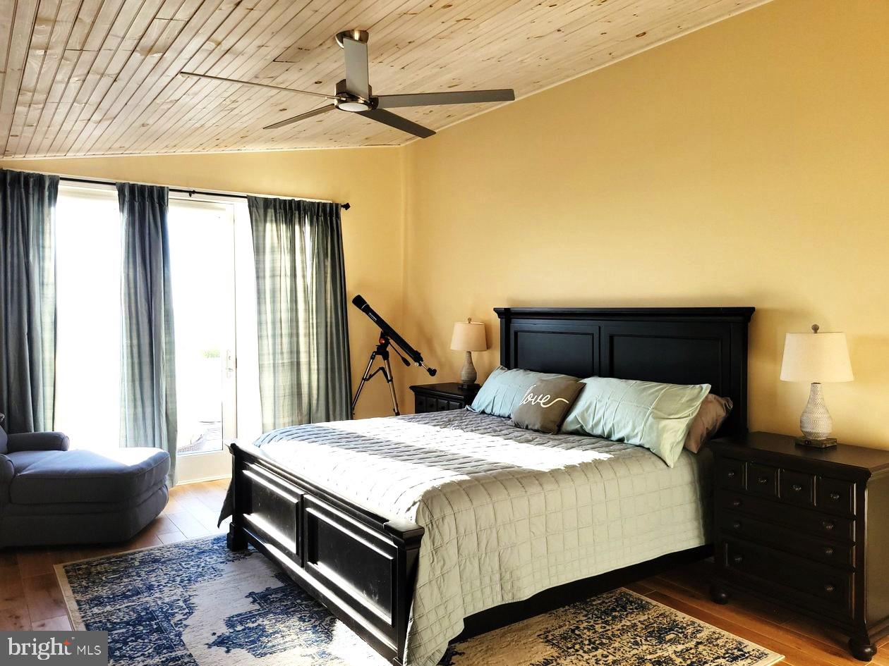 8034 Riverview Road Westover, MD 21871 - Photo 20 of 47 a bedroom with a bed and a window