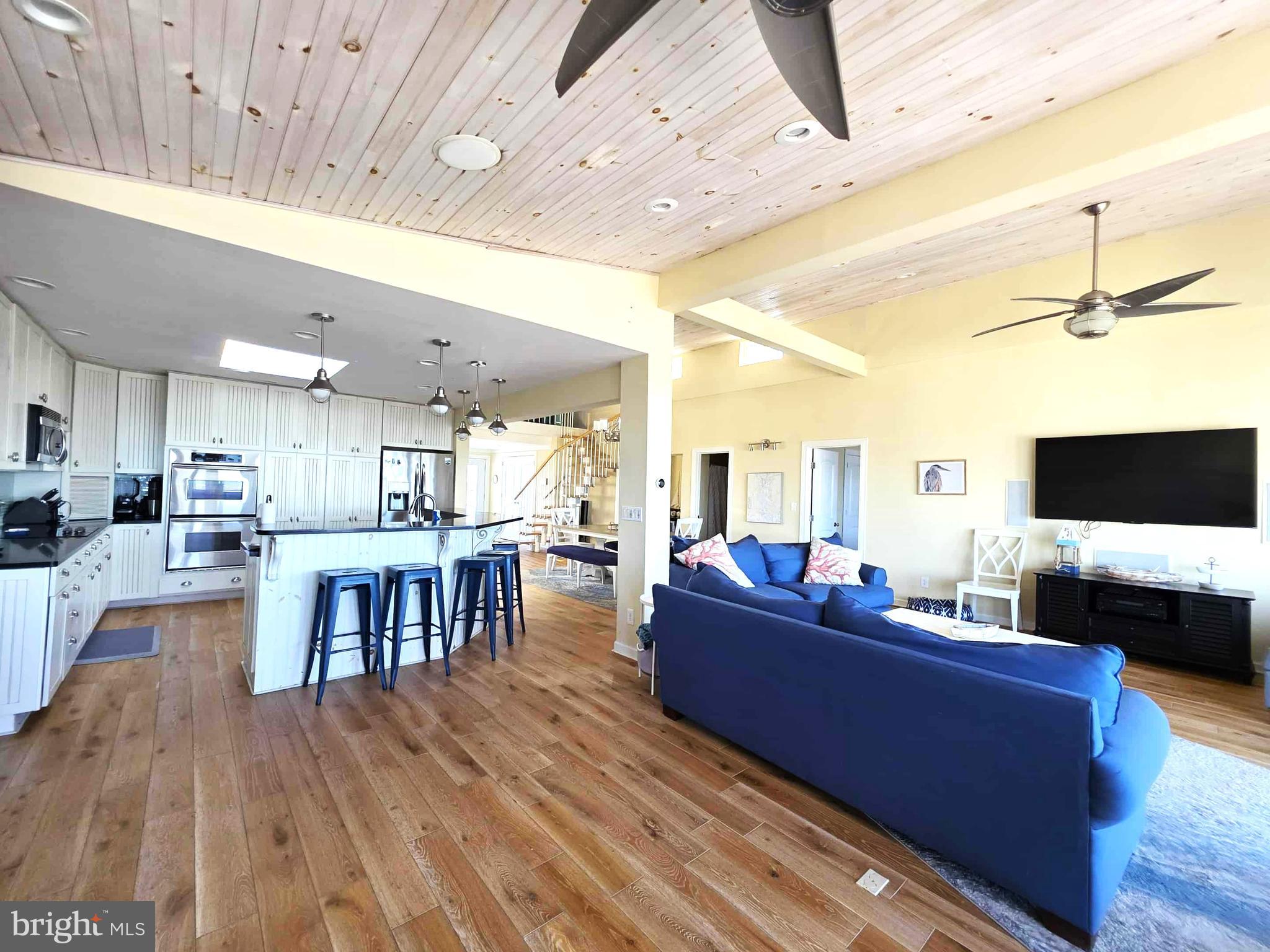 8034 Riverview Road Westover, MD 21871 - Photo 2 of 47 a living room with furniture and a flat screen tv