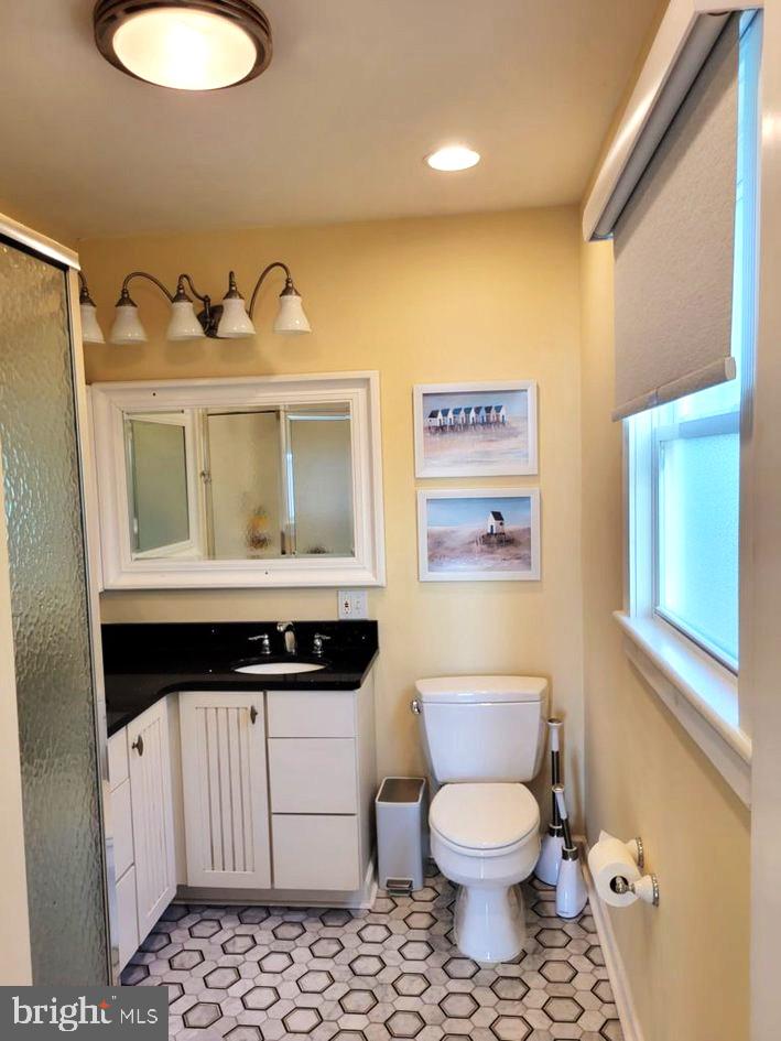 8034 Riverview Road Westover, MD 21871 - Photo 22 of 47 a bathroom with a sink a toilet and a mirror