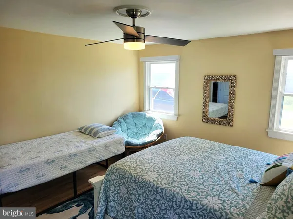 a bedroom with bed and window