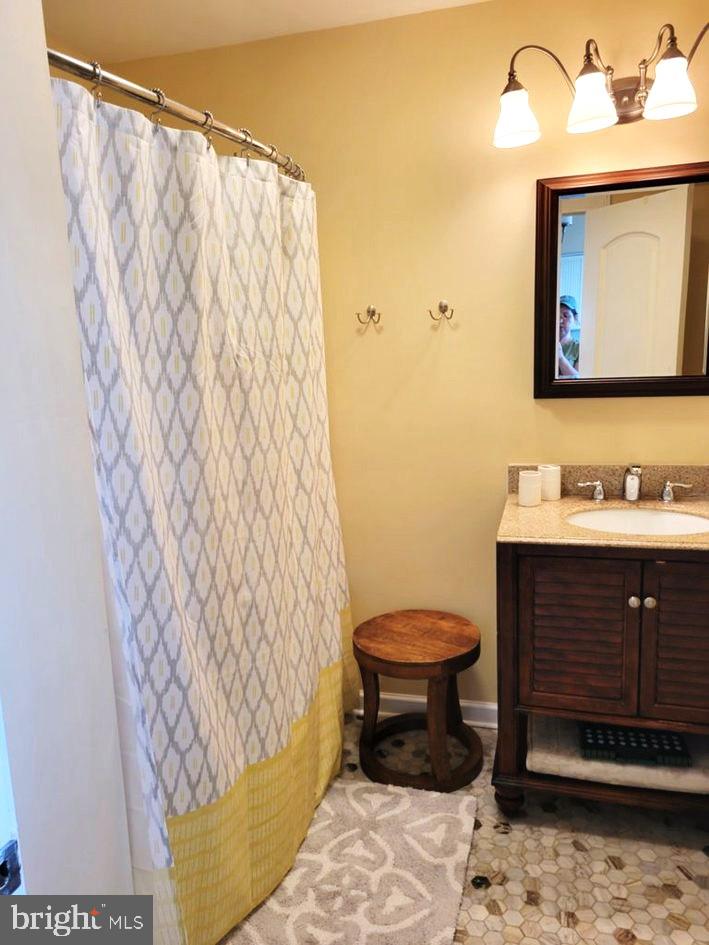 8034 Riverview Road Westover, MD 21871 - Photo 28 of 47 a bathroom with a sink toilet and mirror