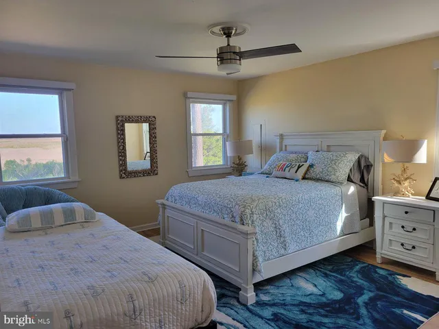 a bedroom with a large bed and a window