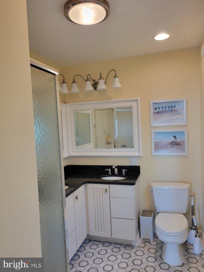 8034 Riverview Road Westover, MD 21871 - Photo 36 of 47 a bathroom with a toilet a sink and mirror