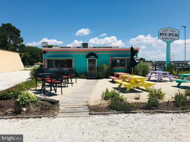 a view of a chairs and table in the patio