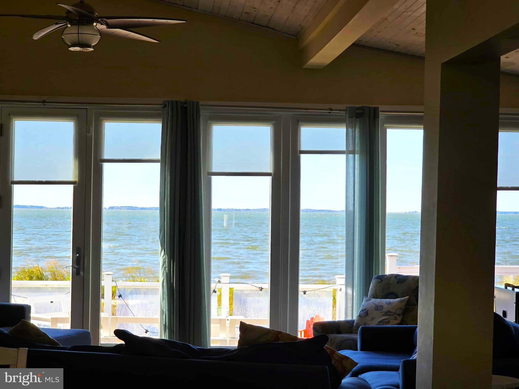 8034 Riverview Road Westover, MD 21871 - Photo 9 of 47 a view of living room with furniture and floor to ceiling window