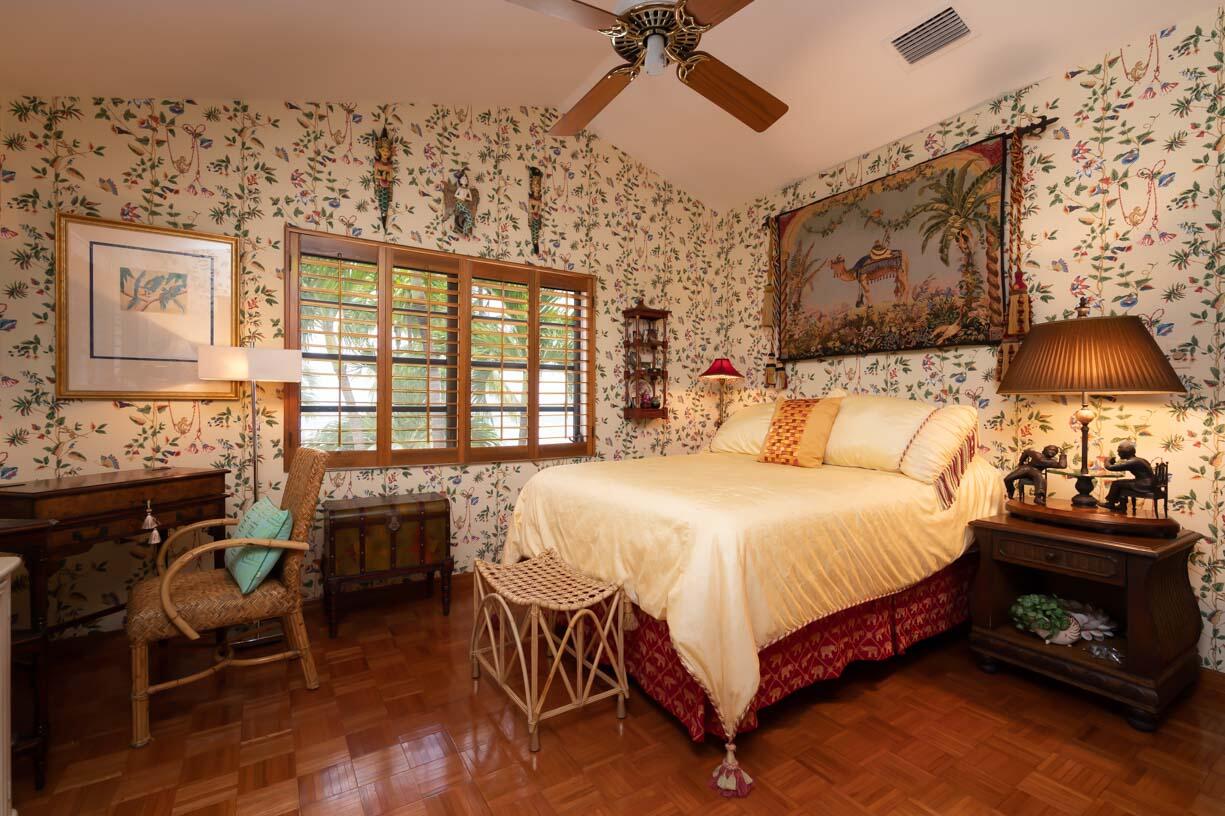 111 Windy Point Circle Marathon, FL 33050 - Photo 20 of 52 a bedroom with a bed and wooden floor