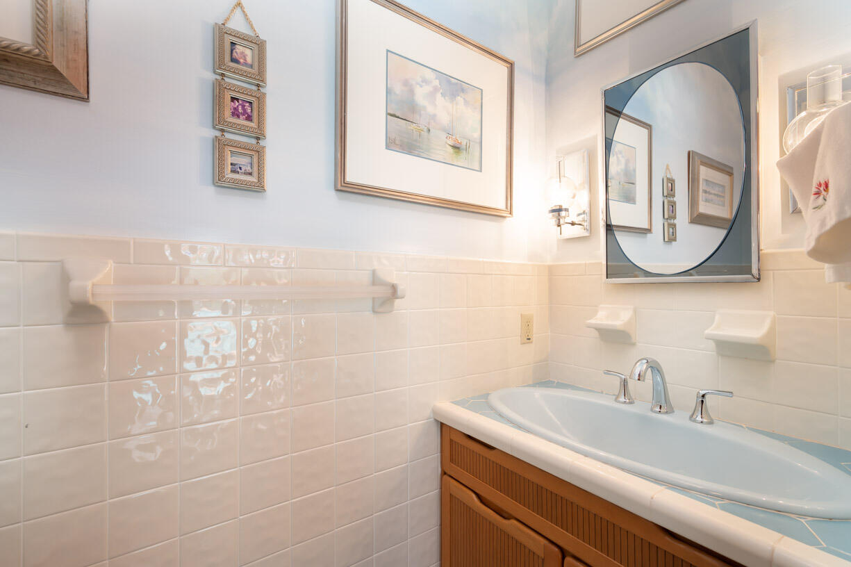 111 Windy Point Circle Marathon, FL 33050 - Photo 21 of 52 a bathroom with a sink and a mirror