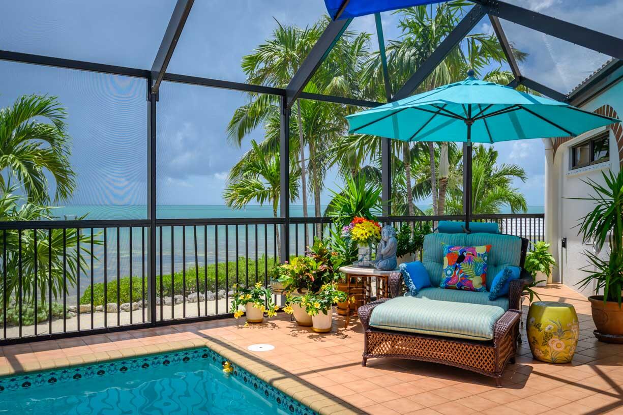 111 Windy Point Circle Marathon, FL 33050 - Photo 43 of 52 a outdoor living space with furniture and umbrella