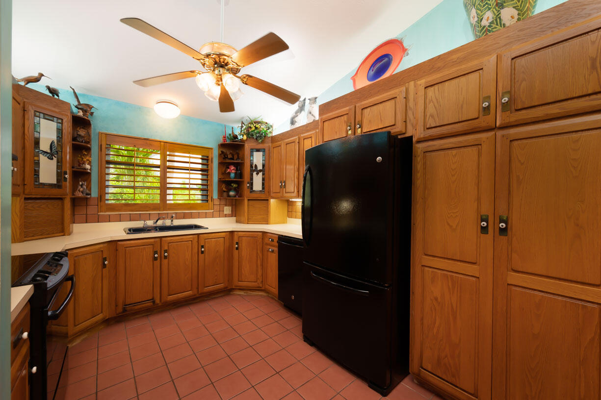 111 Windy Point Circle Marathon, FL 33050 - Photo 8 of 52 a kitchen with a refrigerator and a sink