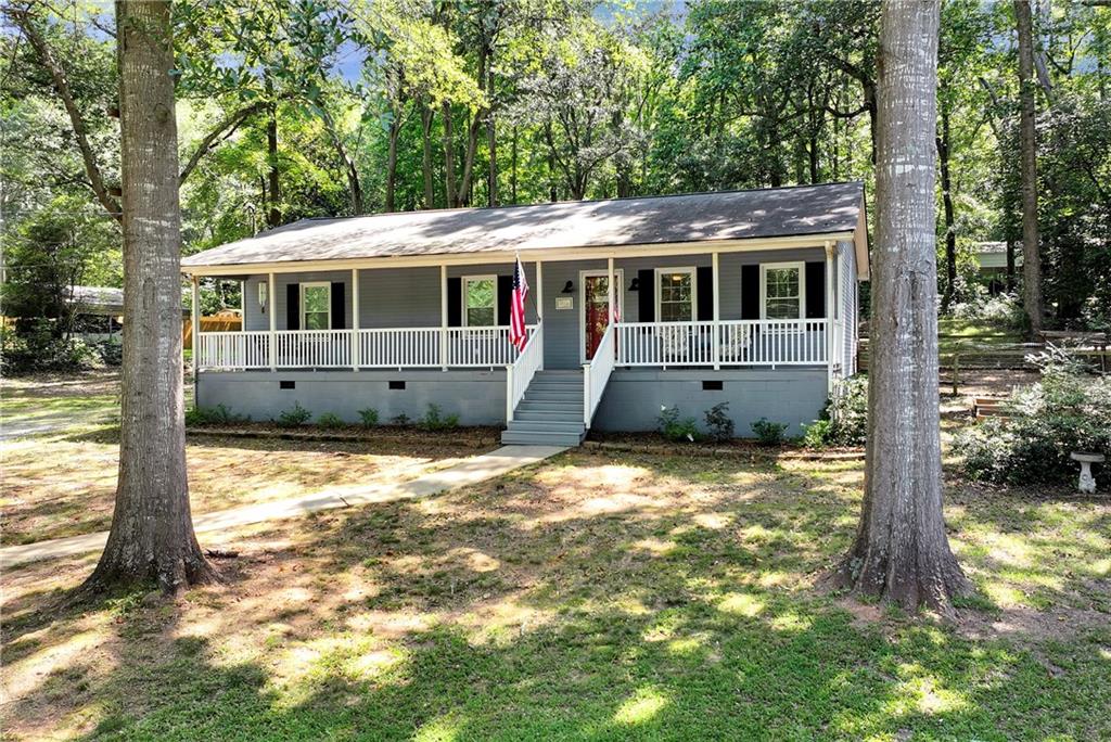 90 Old City Park Road Lavonia, GA 30553 - Photo 2 of 41 a front view of a house with a yard
