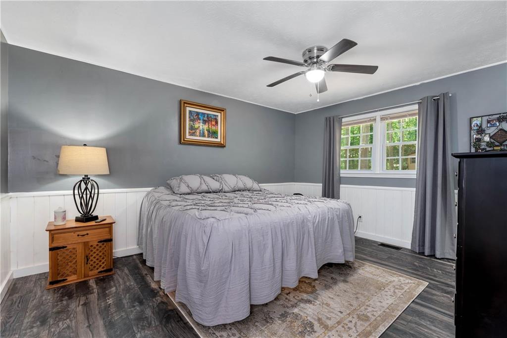 90 Old City Park Road Lavonia, GA 30553 - Photo 22 of 41 a bedroom with a bed and a table