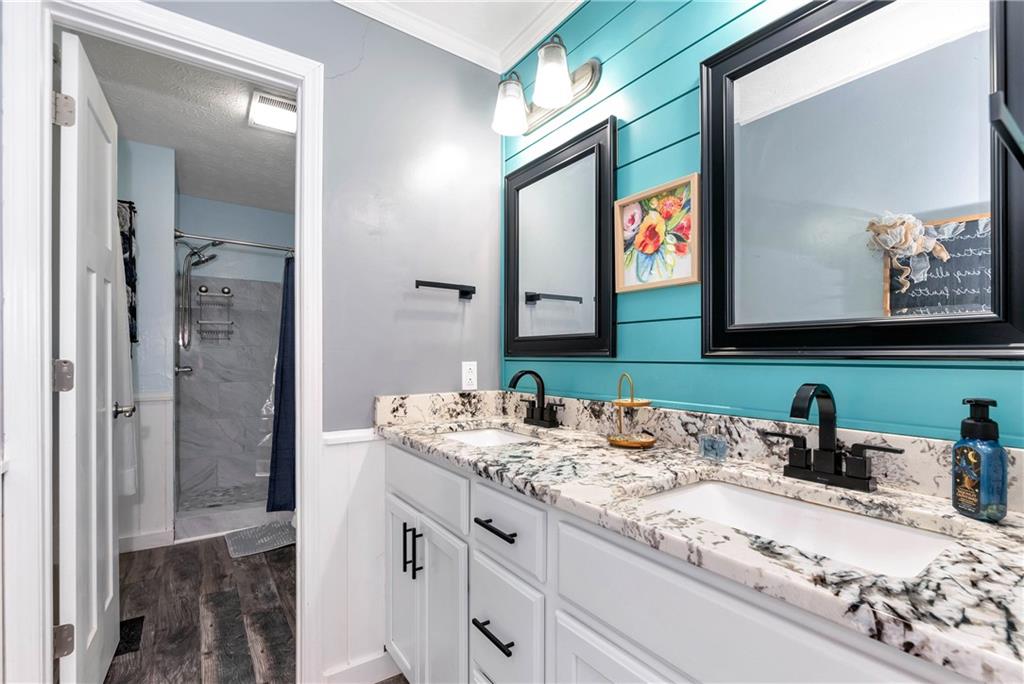 90 Old City Park Road Lavonia, GA 30553 - Photo 24 of 41 a bathroom with a sink vanity and a mirror