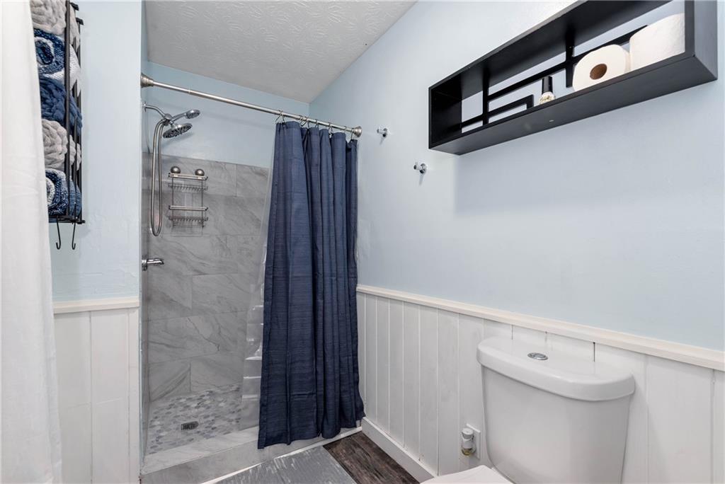 90 Old City Park Road Lavonia, GA 30553 - Photo 25 of 41 a bathroom with a shower and a toilet