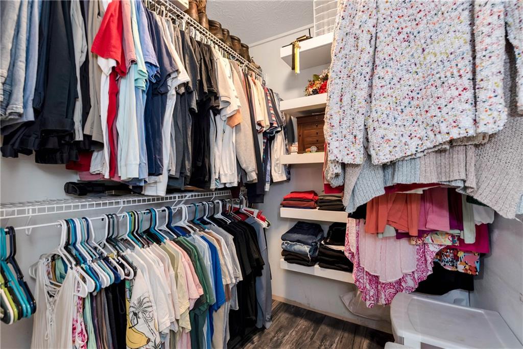 90 Old City Park Road Lavonia, GA 30553 - Photo 26 of 41 a view of walk in closet with clothes and shoes