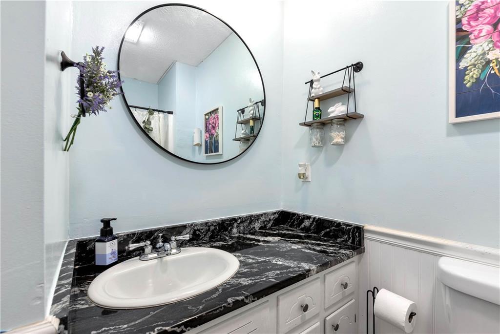 90 Old City Park Road Lavonia, GA 30553 - Photo 30 of 41 a bathroom with a sink and a mirror