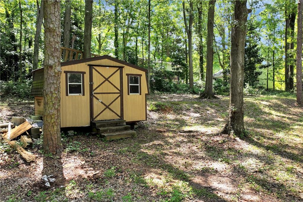 90 Old City Park Road Lavonia, GA 30553 - Photo 33 of 41 a view of a barn in the middle of a yard