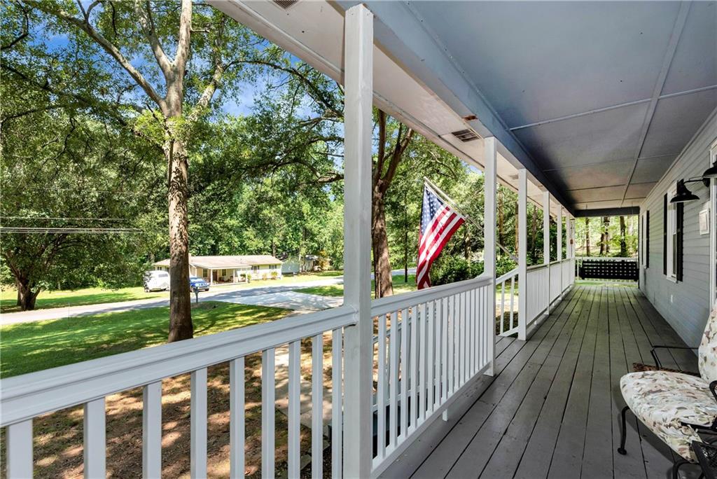 90 Old City Park Road Lavonia, GA 30553 - Photo 5 of 41 a view of a porch with wooden floor and fence
