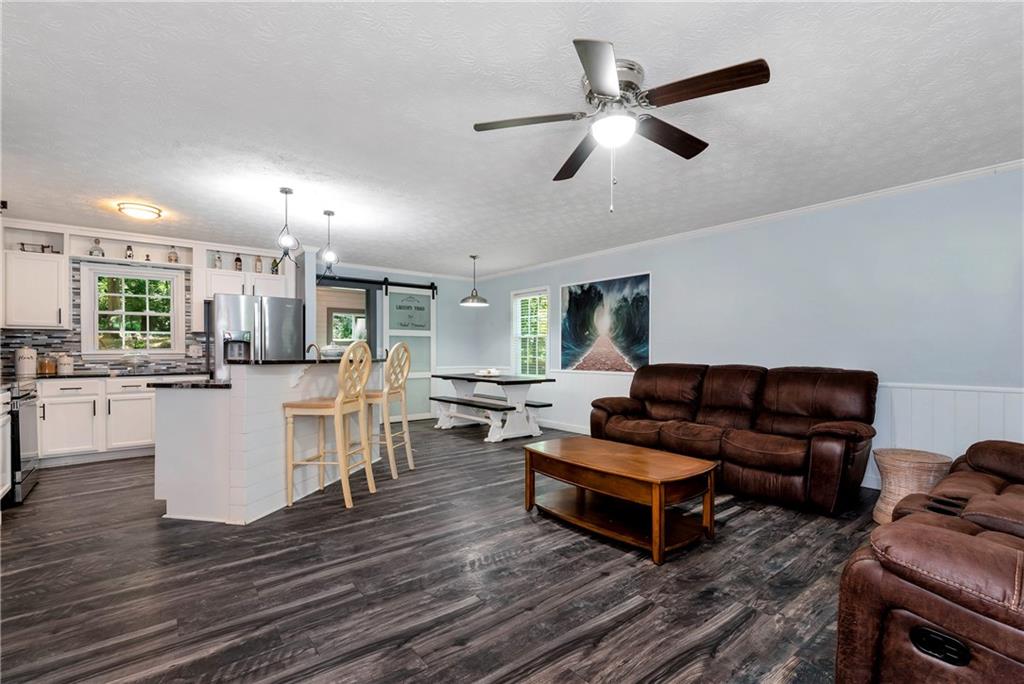 90 Old City Park Road Lavonia, GA 30553 - Photo 9 of 41 a living room with furniture and kitchen view