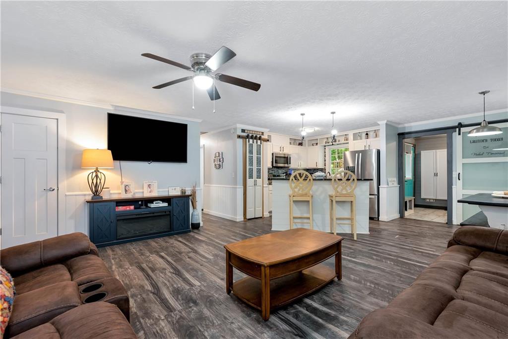 90 Old City Park Road Lavonia, GA 30553 - Photo 10 of 41 a living room with furniture and a flat screen tv