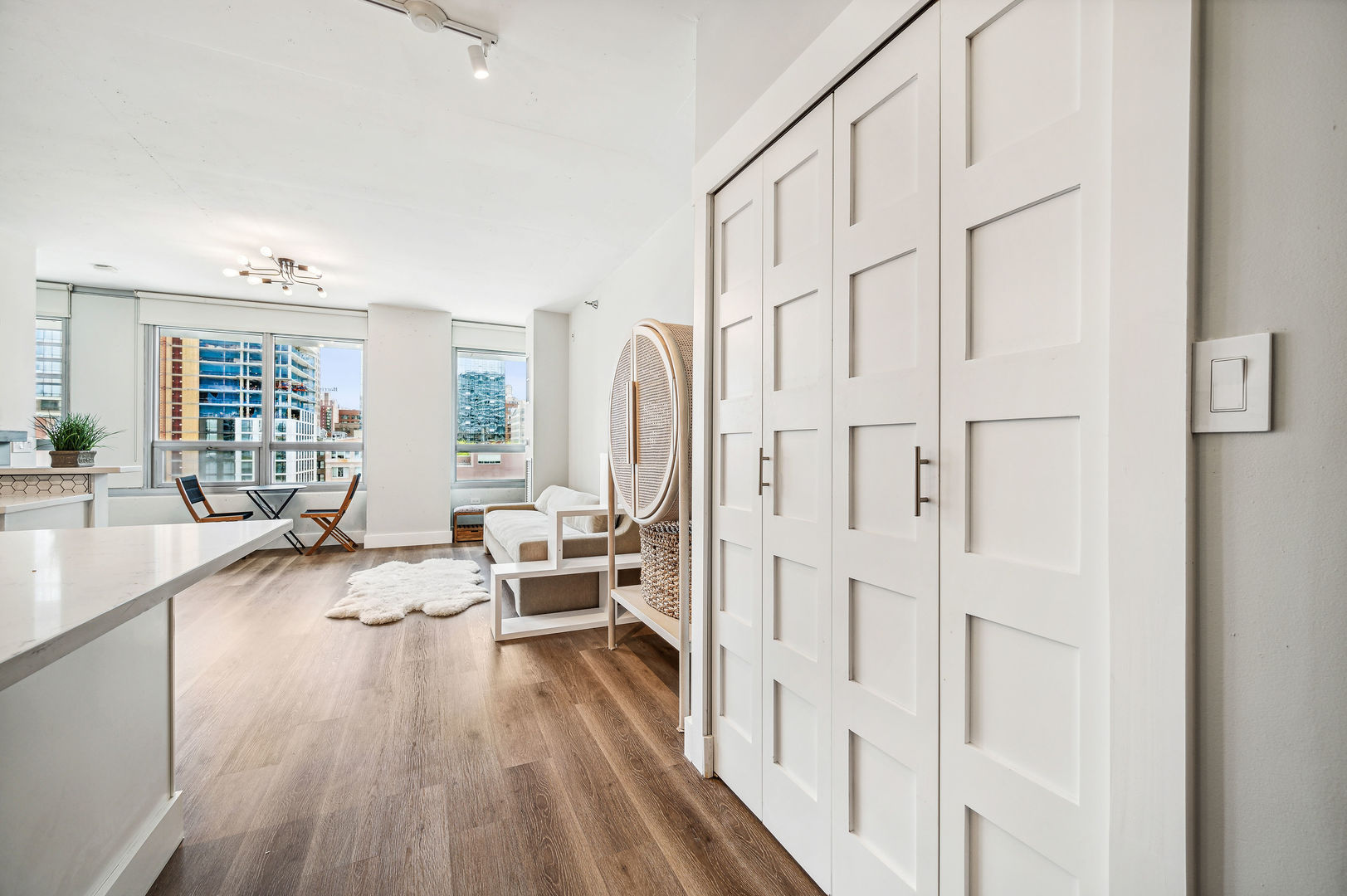 701 South Wells Street, Unit 903 Chicago, IL 60607 - Photo 17 of 20 a living room with furniture a large window and wooden floor