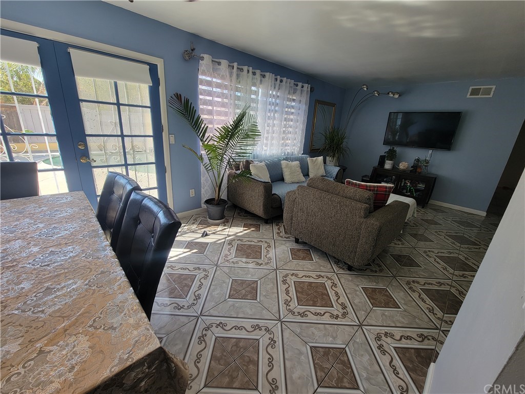 8381 Verde Ridge Road Spring Valley, CA 91977 - Photo 11 of 30 a living room with furniture and a flat screen tv