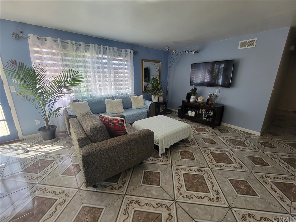 8381 Verde Ridge Road Spring Valley, CA 91977 - Photo 12 of 30 a living room with furniture and a flat screen tv