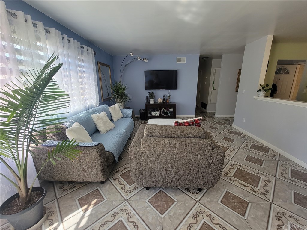 8381 Verde Ridge Road Spring Valley, CA 91977 - Photo 14 of 30 a living room with furniture and a flat screen tv