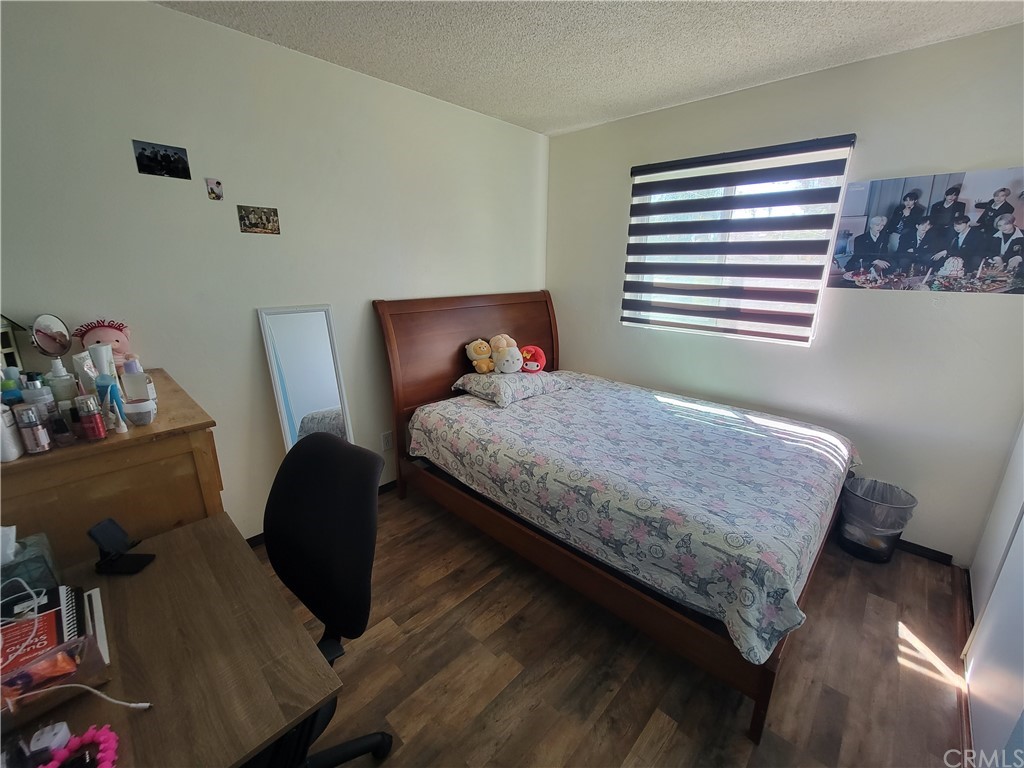 8381 Verde Ridge Road Spring Valley, CA 91977 - Photo 21 of 30 a bedroom with a bed and a window