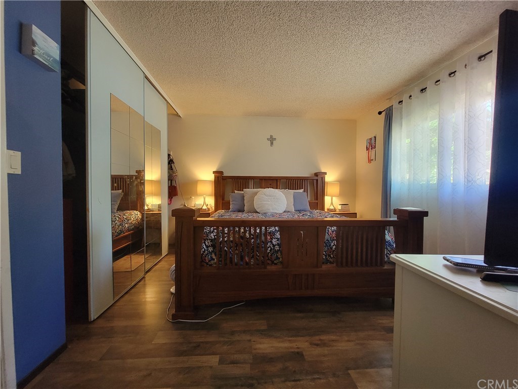 8381 Verde Ridge Road Spring Valley, CA 91977 - Photo 24 of 30 a bedroom with a bed and a mirror