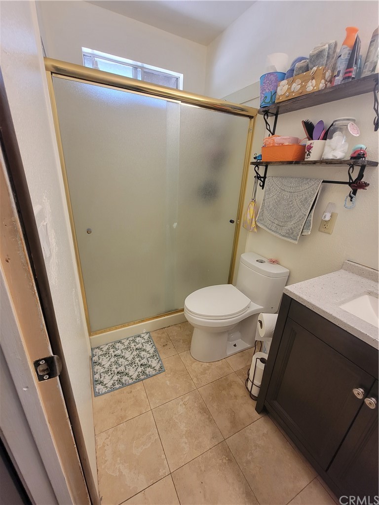 8381 Verde Ridge Road Spring Valley, CA 91977 - Photo 27 of 30 a bathroom with a toilet and a shower