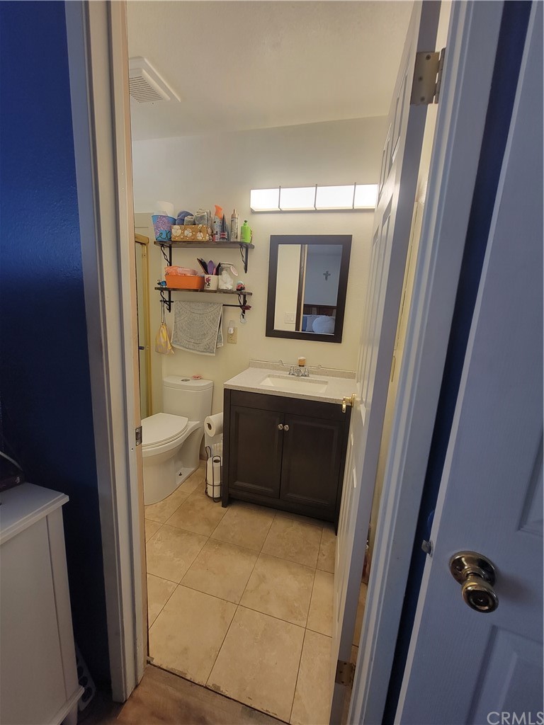 8381 Verde Ridge Road Spring Valley, CA 91977 - Photo 28 of 30 a bathroom with a sink a mirror and bathtub