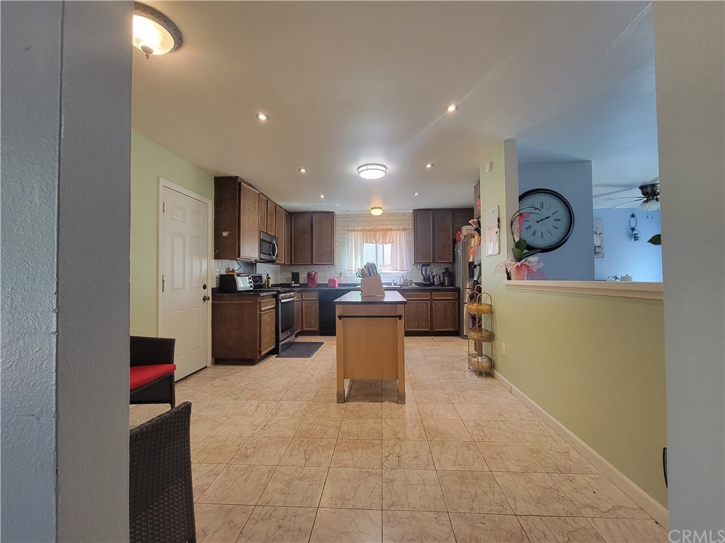 8381 Verde Ridge Road Spring Valley, CA 91977 - Photo 4 of 30 a kitchen with a refrigerator and a sink