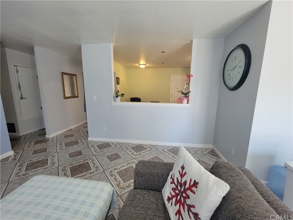 8381 Verde Ridge Road Spring Valley, CA 91977 - Photo 9 of 30 a bedroom with a bed and a chandelier