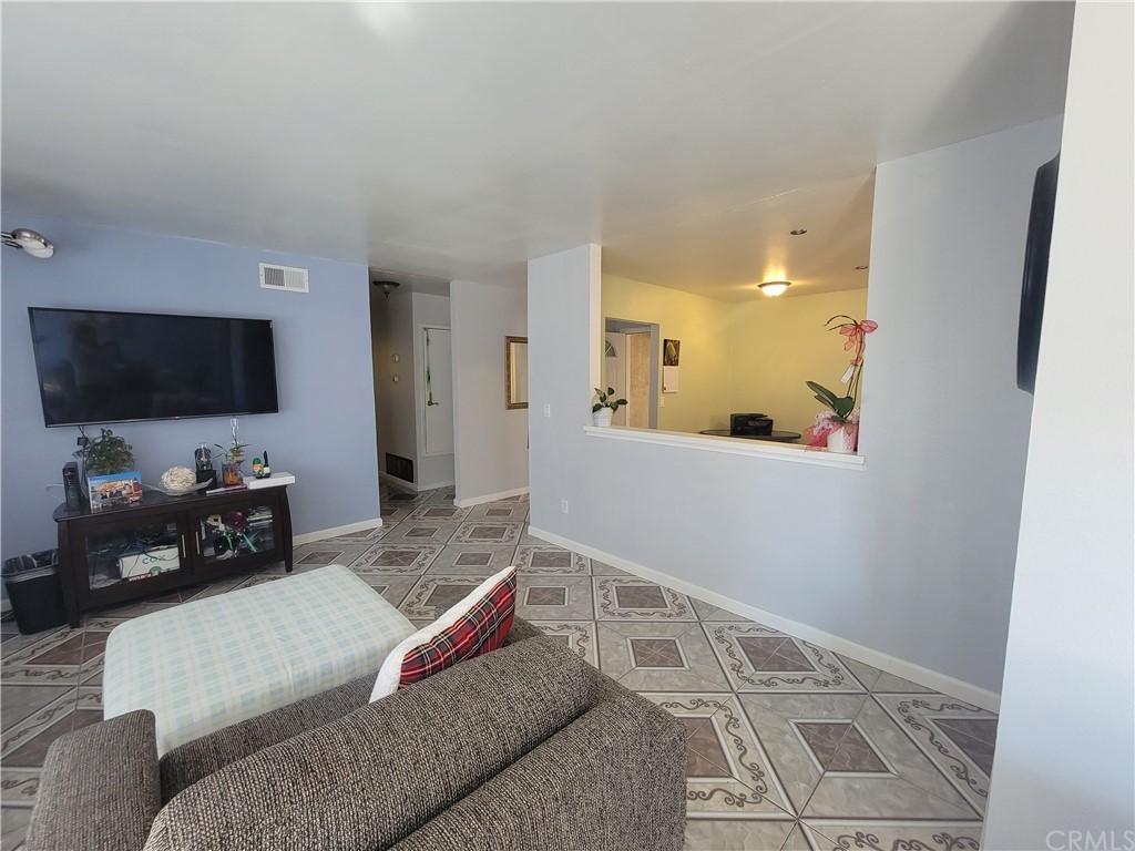 8381 Verde Ridge Road Spring Valley, CA 91977 - Photo 10 of 30 a living room with furniture and a flat screen tv