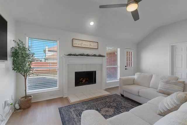 a living room with furniture and a fireplace