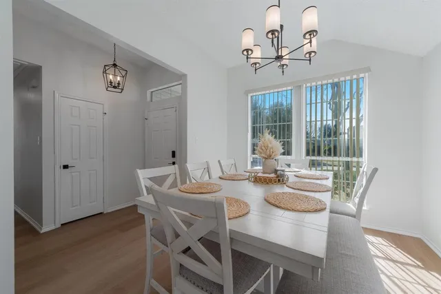 a view of a dining room with furniture window and outside view