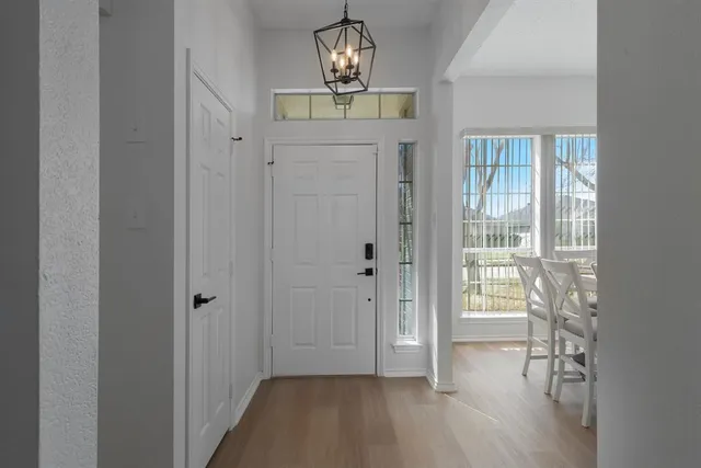 a view of entryway with wooden floor
