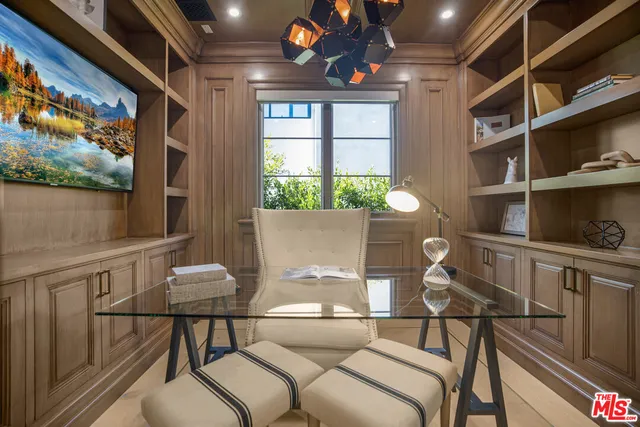 a living room with a couch and a large window