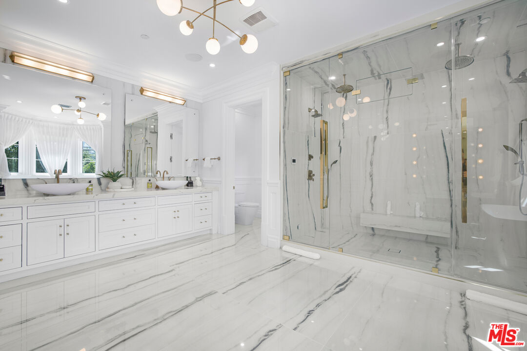 843 North Spaulding Avenue Los Angeles, CA 90046 - Photo 15 of 24 a bathroom with a shower sink vanity granite and shower