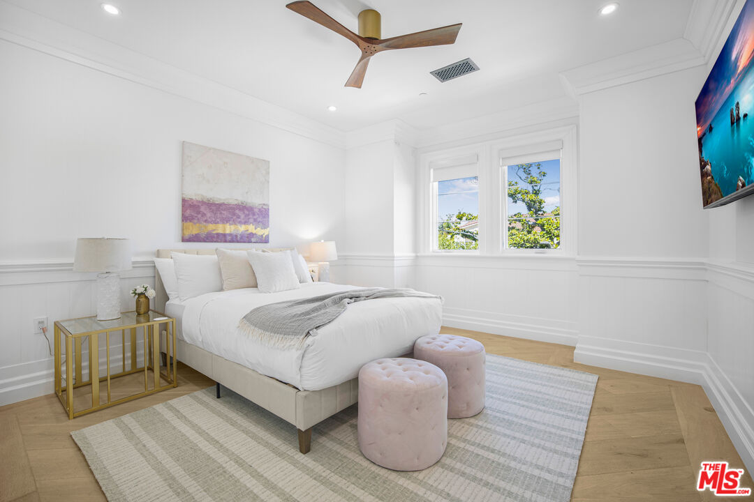 843 North Spaulding Avenue Los Angeles, CA 90046 - Photo 16 of 24 a bedroom with a bed and painting on the wall