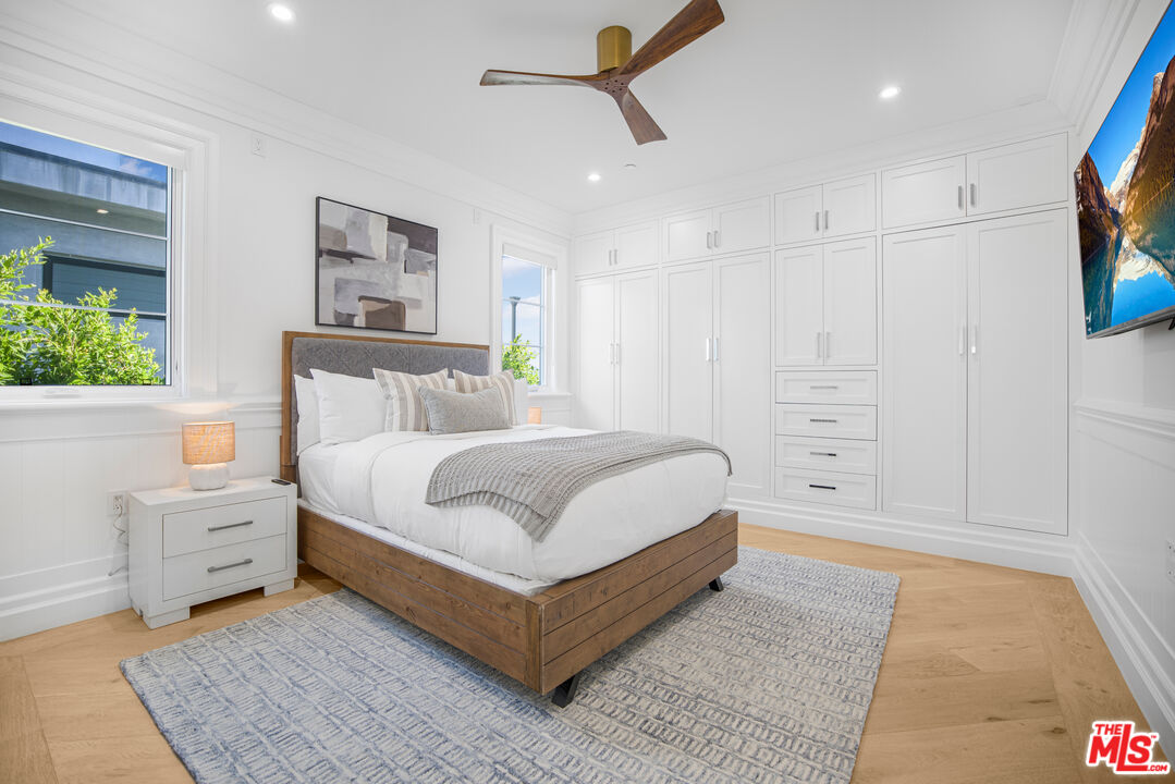 843 North Spaulding Avenue Los Angeles, CA 90046 - Photo 18 of 24 a white bed sitting in a bedroom next to a window